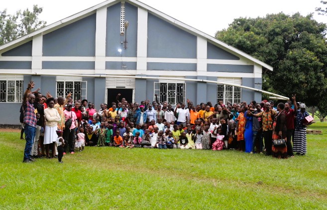 Team and children smiling at Bushfire Children's Home